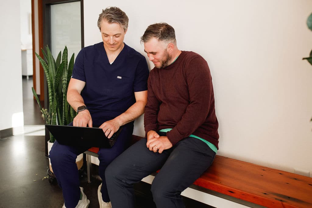 Dr. Borys reviewing treatment options with a patient during a consultation
