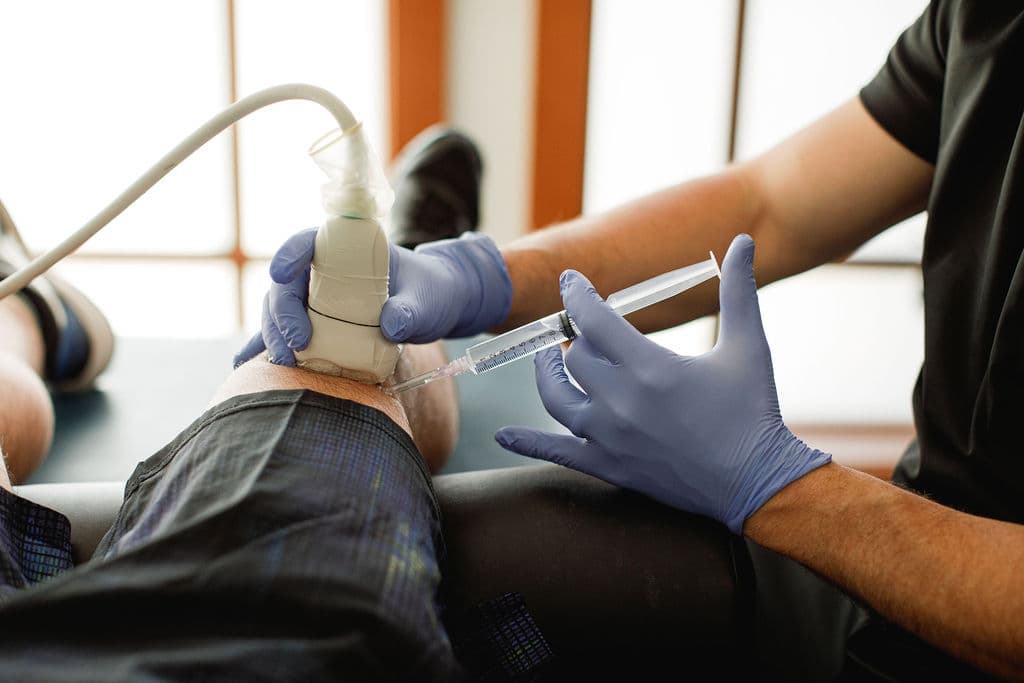 Dr. Borys preparing an ultrasound-guided PRP injection